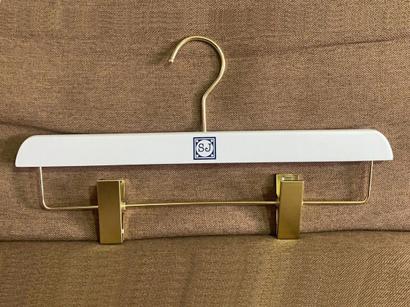 White wooden hanger with custom logo