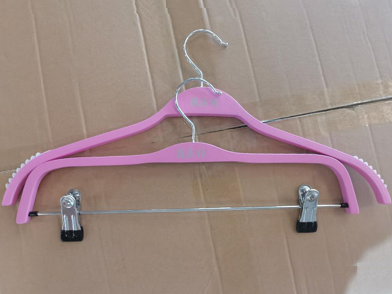 Pink color wooden hanger for clothes shop