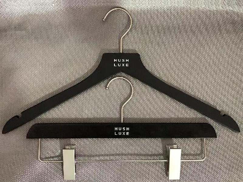 Black wooden hanger with silver metal parts , shirt hanger and pants hanger