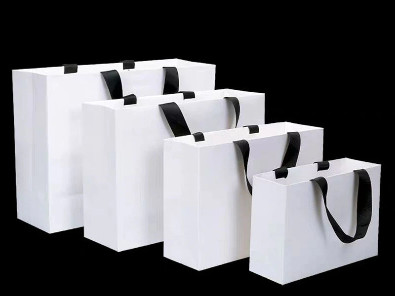 Black handle with white bag ,shopping bag